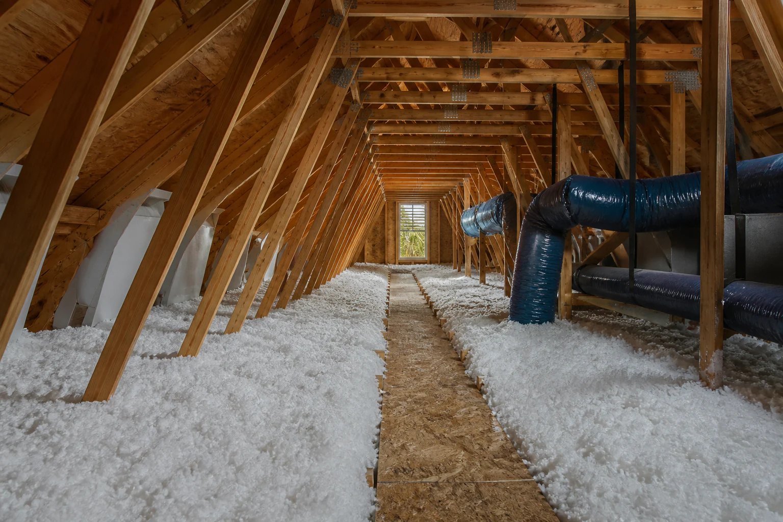 A clean, evenly insulated attic after a professional blown-in installation